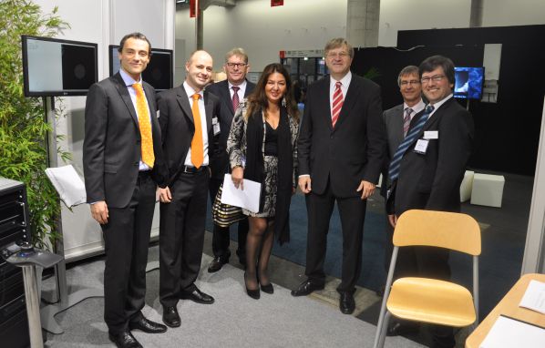 Peter Hinze, MdB, Parliamentary State Secretary at the Ministry of Economy and Technology, Federal Government of Germany and the Coordinator of Aerospace visiting the booth of Astos Solutions on the Airtec 2011